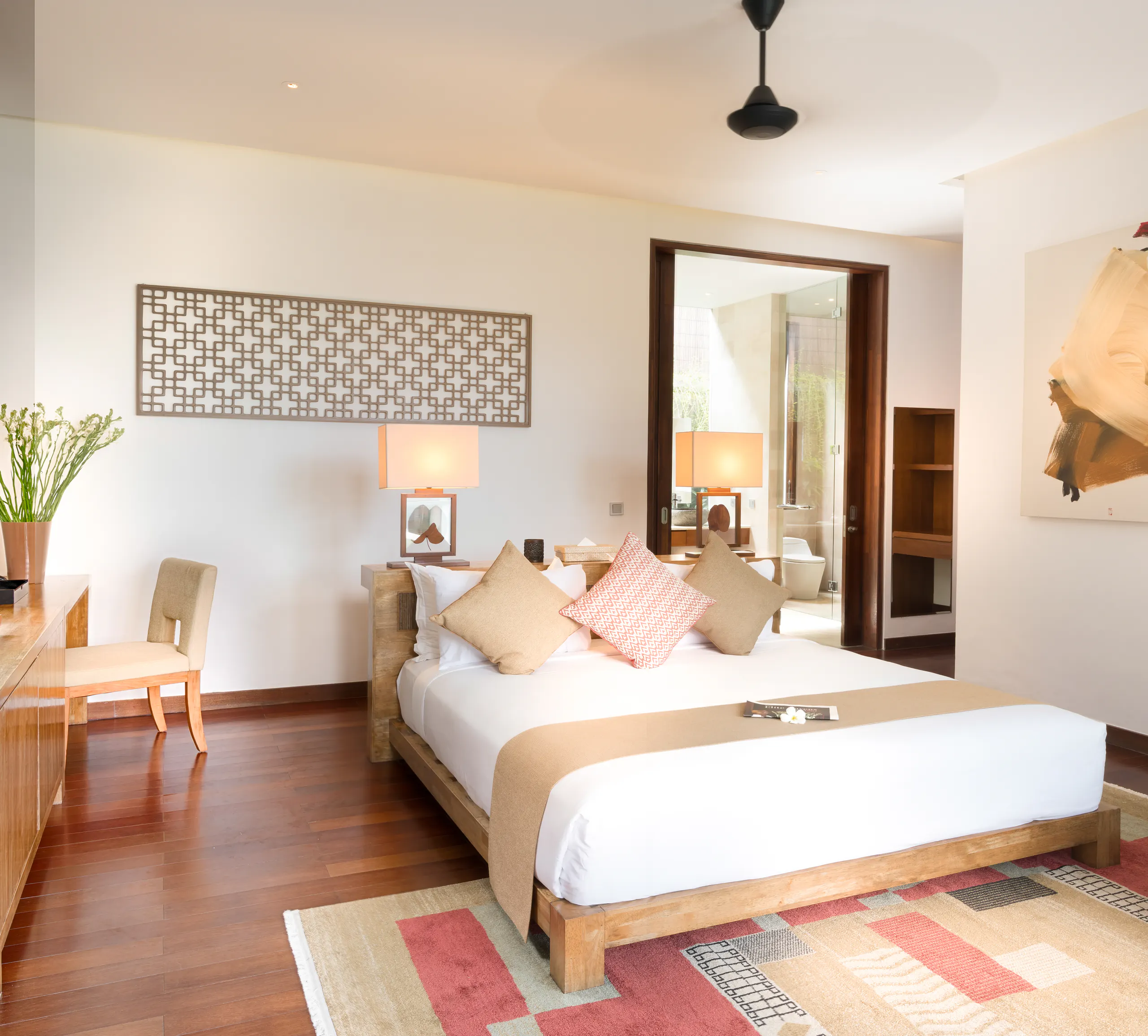 Master Suite I at Casa Brio, the king bed on a kilim rug with the bathroom door beyond