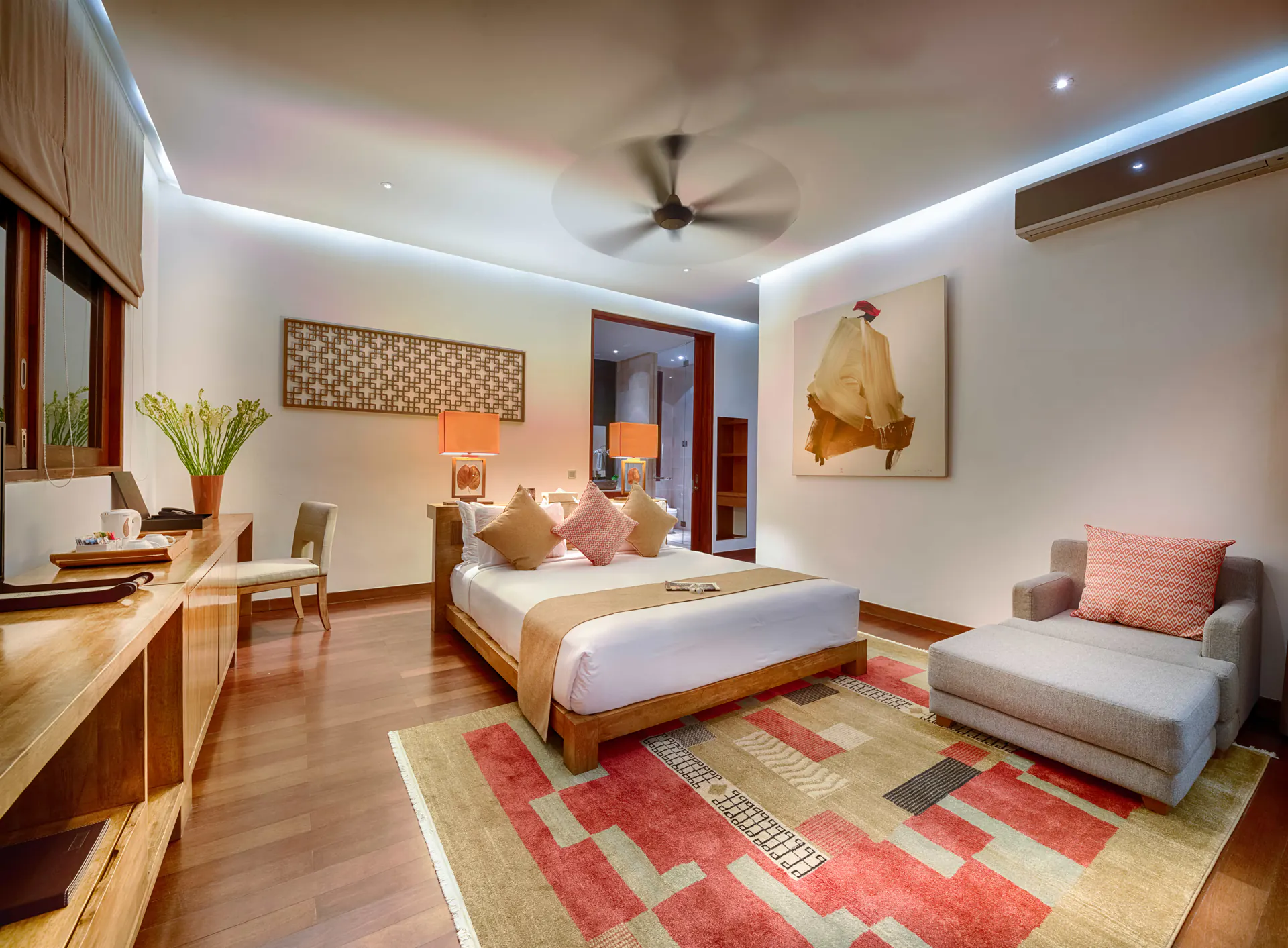 Master Suite I at Casa Brio by lamplight, the king bed on a red-and-cream kilim rug